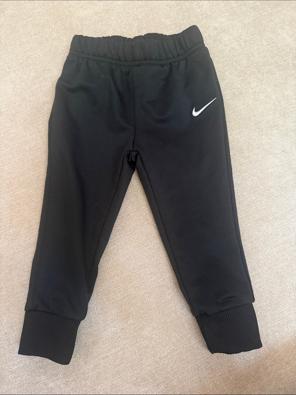 Nike Kids Black Jogger Pants with White Swoosh Accent